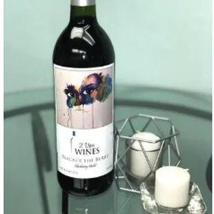 a bottle of wine on a glass table