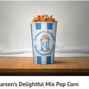 a cup of popcorn on a table