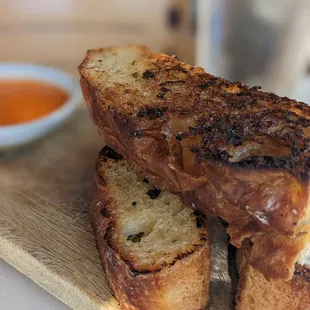 grilled bread on a cutting board