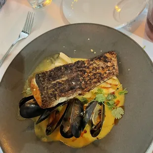 a plate of fish and mussels