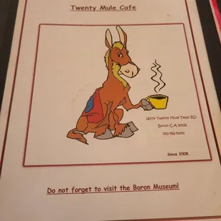 a donkey holding a cup of coffee