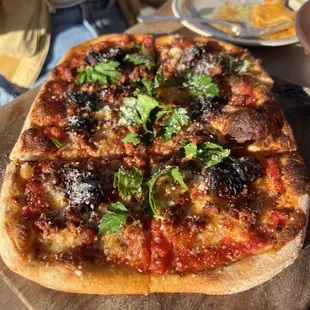 a pizza on a wooden board
