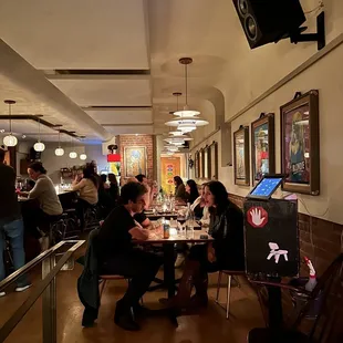 a group of people eating at a restaurant