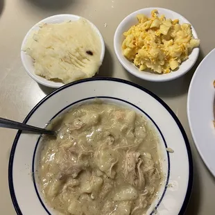 Chicken and Dumplings with a side of mashed potatoes and macaroni and cheese.