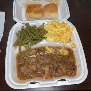 Hamburger steak (in standing water), Mac and cheese (also in standing water) and green beans