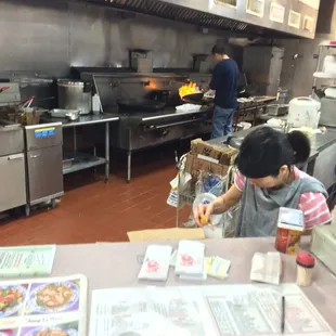 He's doing work making my to go order. Super nice people, even right before they close:)