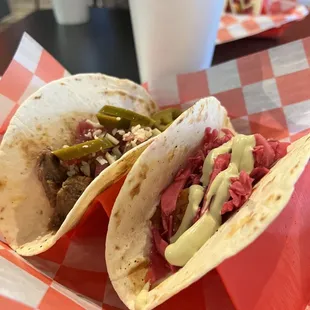 two corned beef tacos with pickles