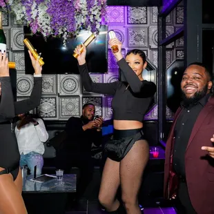 a couple of people dancing at a party