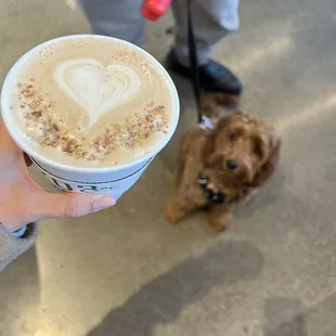 a person holding a cup of coffee