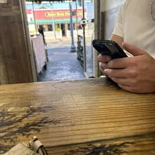 Right next to the door. Yelled hello 5 times before an employee showed up, we were looking for another pizza place when he responded.