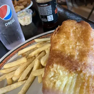 Fish and chips. The batter was crunchy and the thick juicy tender fish was awesomely cooked.  The malt vinegar was the finishing touch!