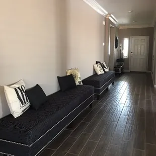 8 foot ottomans with nail heads...