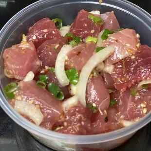 a bowl of meat and onions