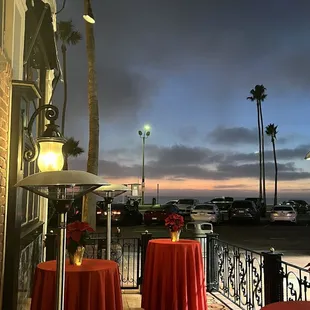 tables with red tablecloths on them