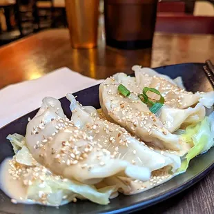 boiled gyoza w/sesame sauce $5