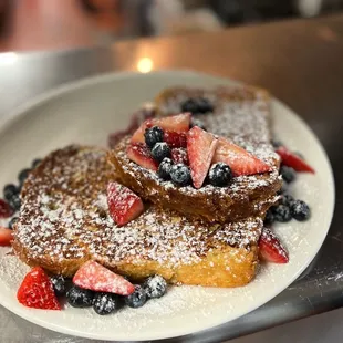 Vanilla custard dipped French toast with seasonal berries