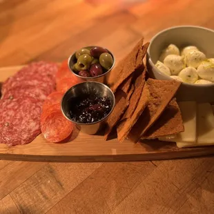 Charcutterie board Seasonal cheeses and meats Marinated olives, house made lavosh cracker Red onion marmalade