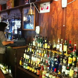 a woman standing at the bar