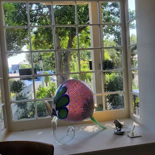 Looking out the window, hand blown glass art by local artist. Stunning view and art piece.