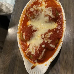 a pizza in a dish on a table