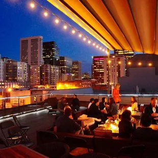 Guests on the roof deck will enjoy a panoramic view of the city while they lounge and mingle in the lavish open-air space.