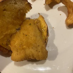 Square shaped chicken patty, probably from the same bag as the "tenders".