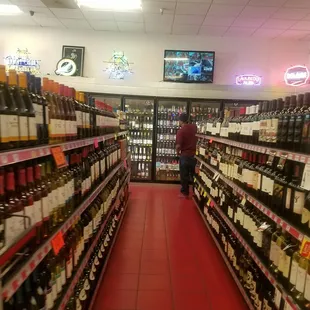 rows of bottles of wine in a liquor store