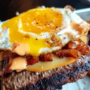 Delicious runny egg on burger