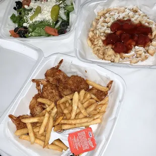 Greek salad, strawberry funnel cake, coconut shrimp and fries combo. Take out, friendly service, and convenient hours during covid 19!