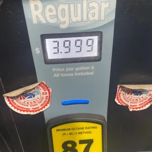 a gas pump with a clock on it