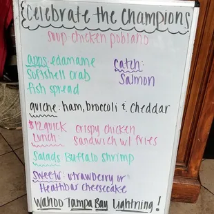 a white board with a list of food items on it