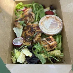 MARKET GRAIN SALAD, HARISSA GRILLED CHICKEN, SESAME SOY LEMON DRESSING.