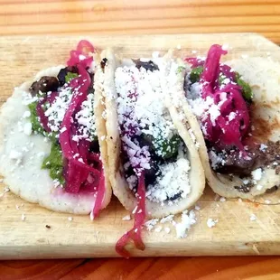 Carne Asada Taco: house made tortillas, prime sirloin, avocado chimichurri, Cotija