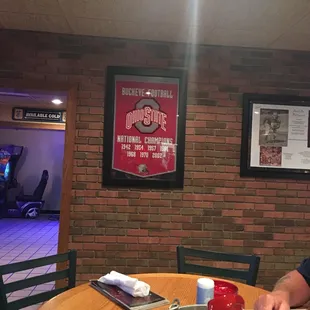a man sitting at a table with a plate of food