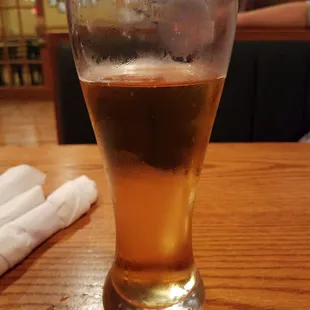 a glass of beer on a table