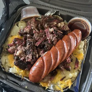Loaded potato with brisket and sausage link