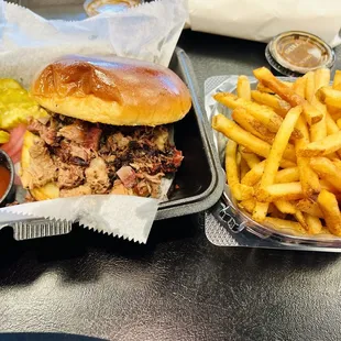 Chopped brisket sandwich and fries