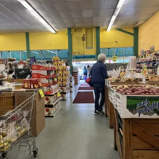 a man walking through a grocery store