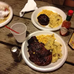 three plates of food on a picnic table