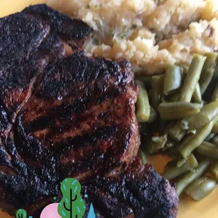 Medium rare steak with green beans and homemade mash potatoes