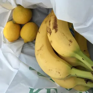 a bunch of bananas and lemons
