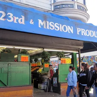 people walking in front of the store