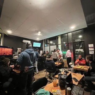 a large group of people sitting at tables