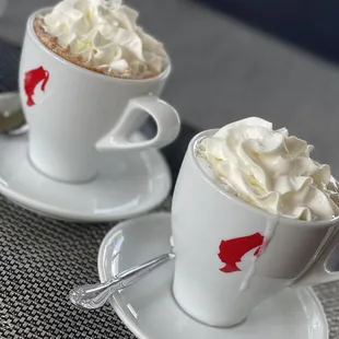 two cups of coffee with whipped cream