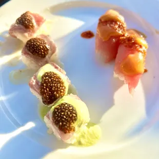 Toro and salmon with signature sauces and garnishes