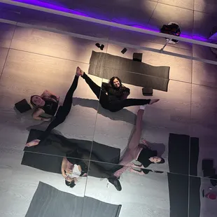 Enjoy a fun flexibility class in our floorwork space with a mirrored ceiling!