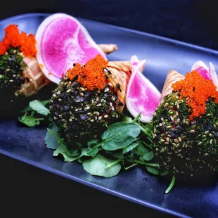 Poke Cones
Diced Ahi, Sesame, Seaweed, Tempura Eggplant, Charred Scallions, Tobiko, Soy