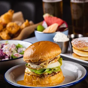a plate with a sandwich and a bowl of salad