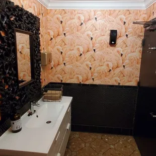 Flamingo decor in men's restroom