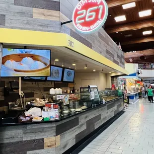 Ground Floor, walk down the aisle on the right side. Stall 302 in this clean mall.